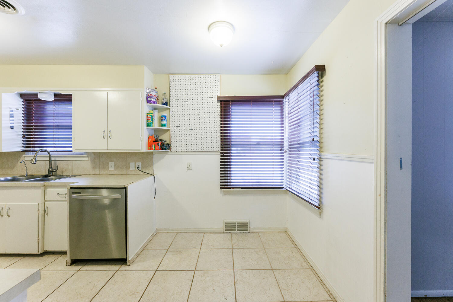 3501 26th Street Lubbock, TX 79410 - Photo 15 of 36 a view of a kitchen with a sink and cabinets