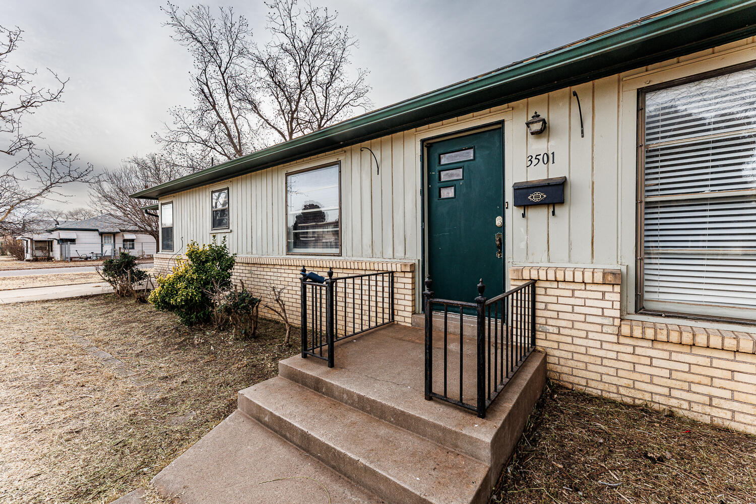 3501 26th Street Lubbock, TX 79410 - Photo 2 of 36 a front view of a house with garden