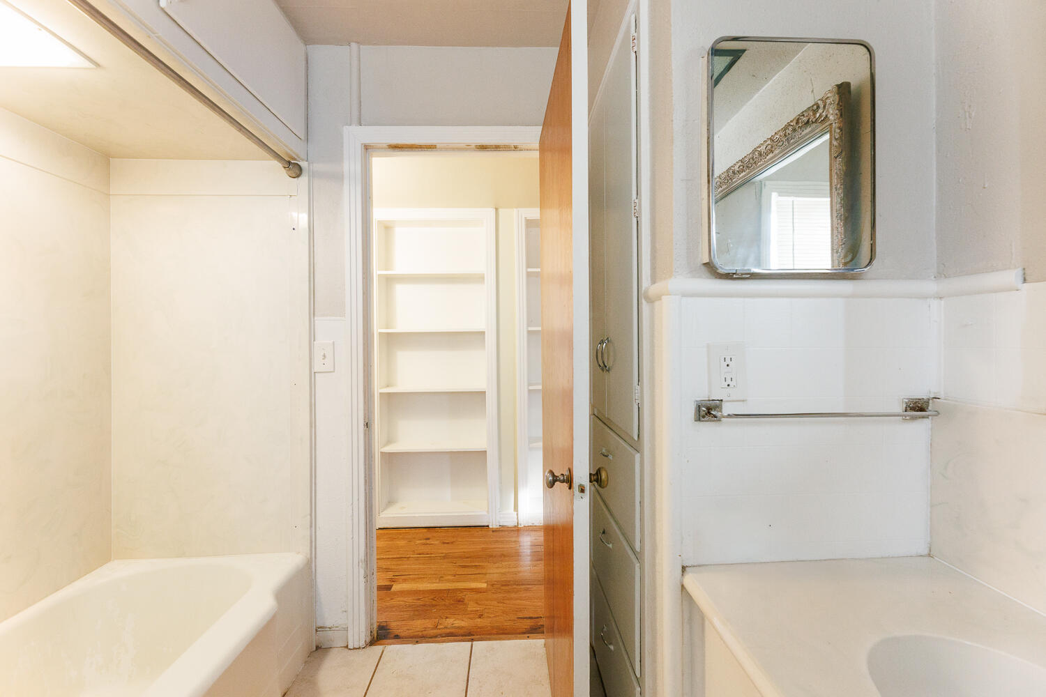 3501 26th Street Lubbock, TX 79410 - Photo 24 of 36 a bathroom with a tub shower and a sink