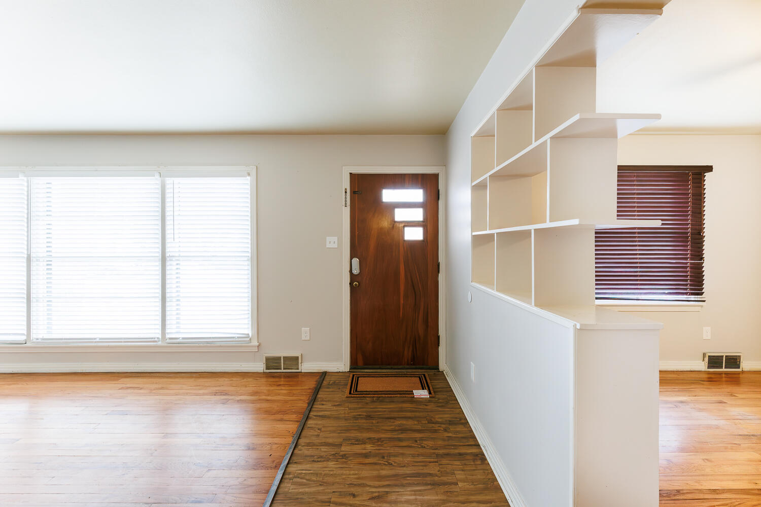 3501 26th Street Lubbock, TX 79410 - Photo 3 of 36 a view of a hallway with wooden floor and staircase