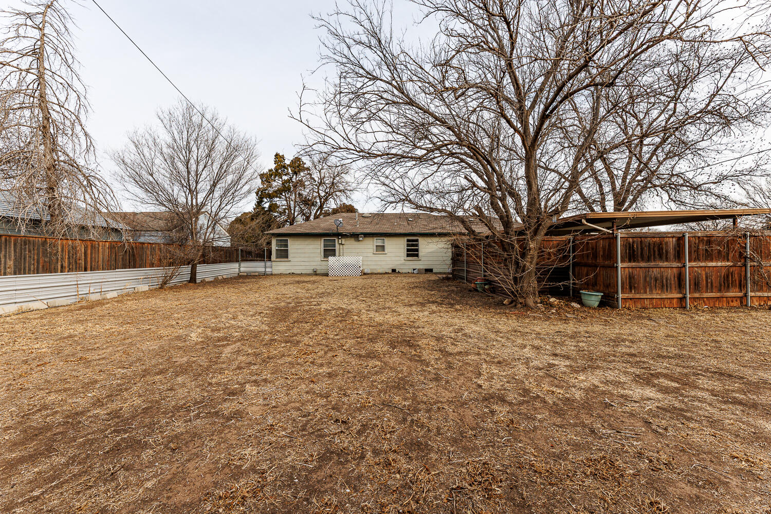 3501 26th Street Lubbock, TX 79410 - Photo 34 of 36 a front view of a house with a yard and garage