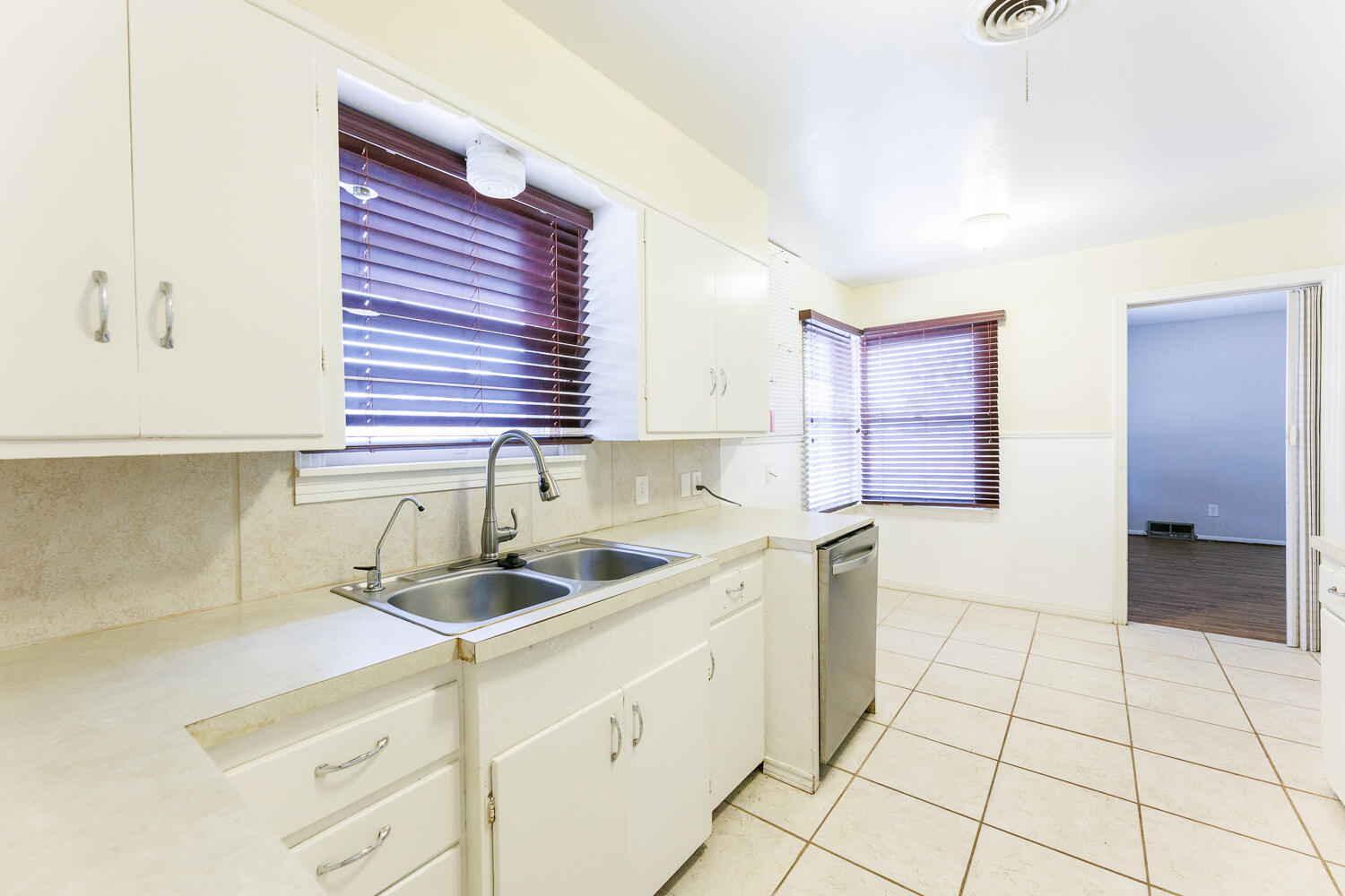 3501 26th Street Lubbock, TX 79410 - Photo 10 of 36 a kitchen with a sink and cabinets