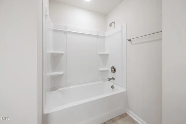 a view of a house with backyard porch and sitting area