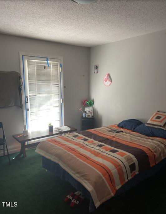 4001 Pickwick Drive Raleigh, NC 27613 - Photo 4 of 5 a bedroom with a bed and a window