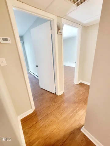 a view of an empty room with a window