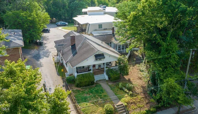 a view of a brick house with many windows