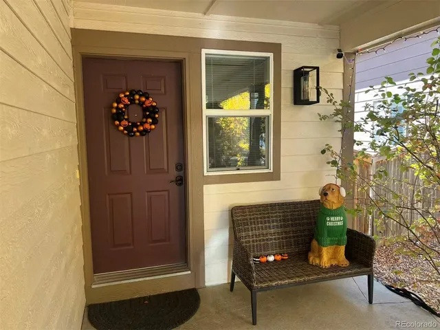 a room with painting on the wall and a window