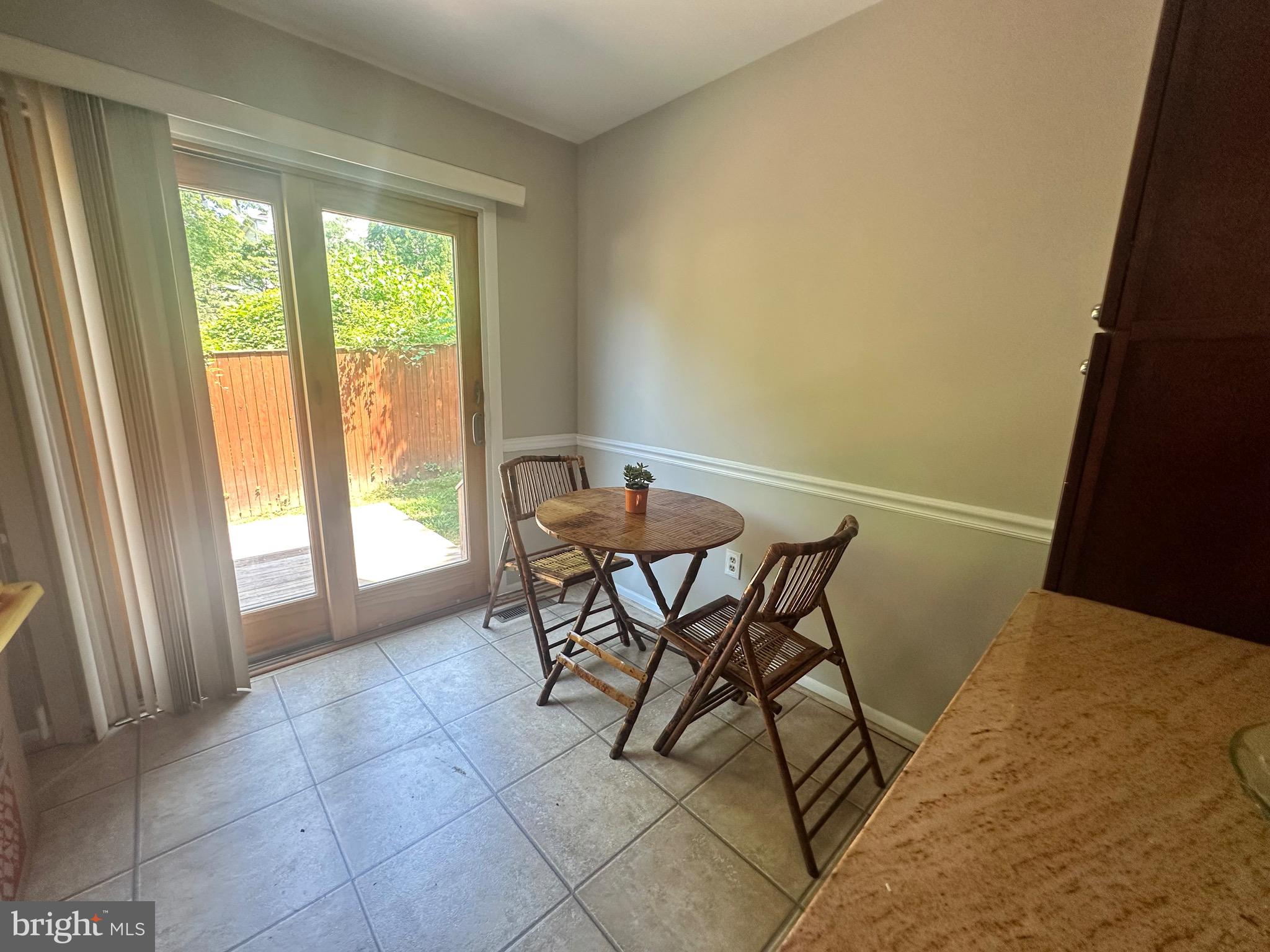 9705 Glen Avenue Silver Spring, MD 20910 - Photo 11 of 43 a view of a dining room with furniture and a window