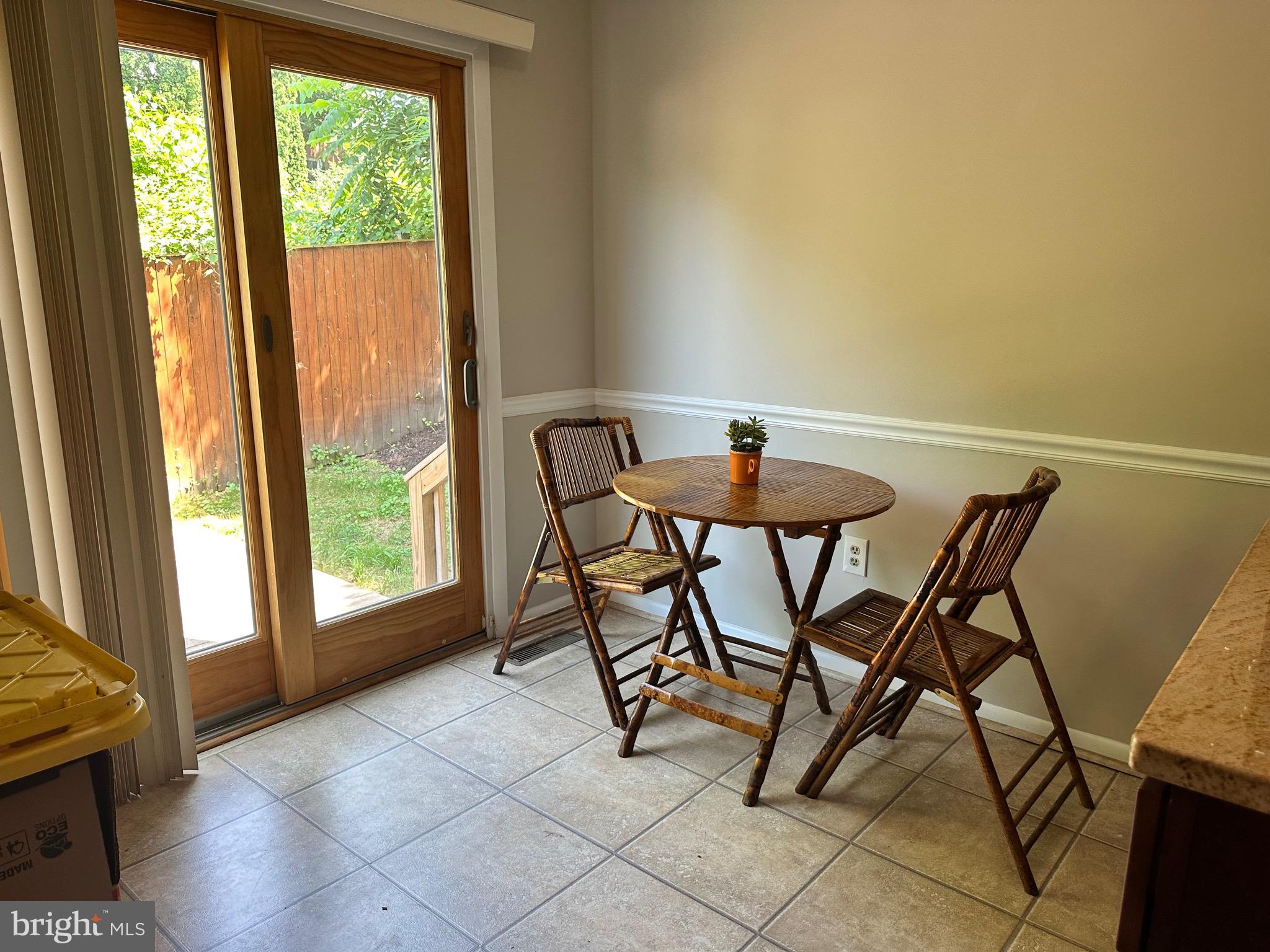 9705 Glen Avenue Silver Spring, MD 20910 - Photo 9 of 43 a view of a dining room with furniture and a window