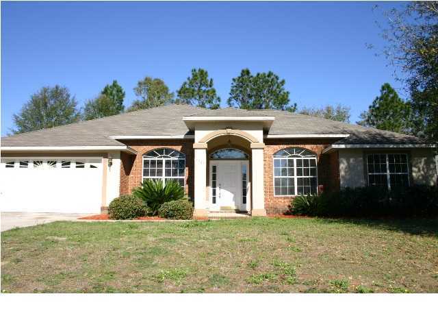 4481 Antioch Road Crestview, FL 32536 - Photo 1 of 21 a front view of a house with a yard