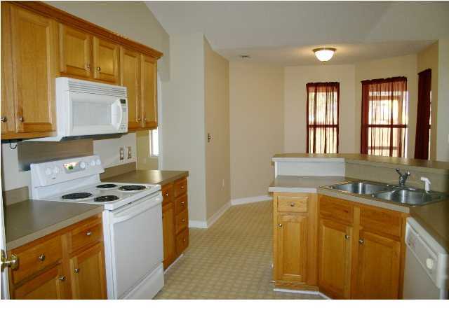 4481 Antioch Road Crestview, FL 32536 - Photo 8 of 21 a kitchen with stainless steel appliances granite countertop a sink stove and refrigerator