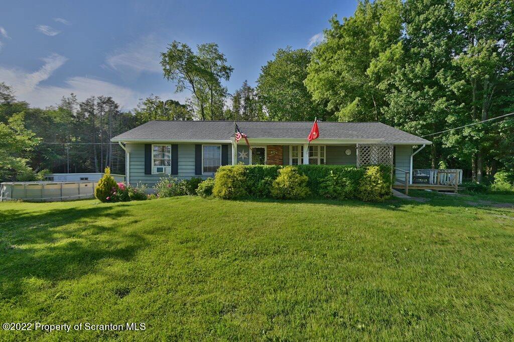 217 Hemlock Road Lake Ariel, PA 18436 - Photo 1 of 54 a house with a garden space