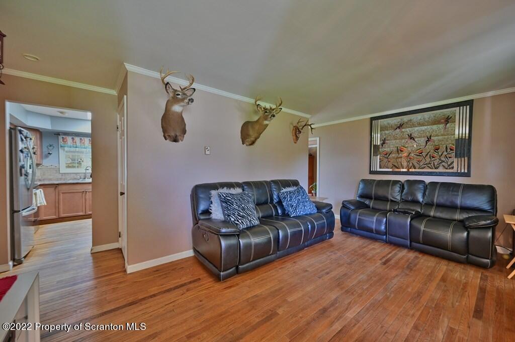 217 Hemlock Road Lake Ariel, PA 18436 - Photo 14 of 54 a living room with furniture and a wooden floor