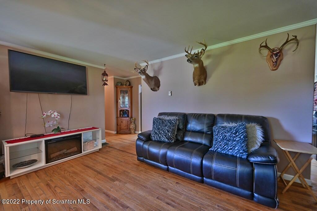 217 Hemlock Road Lake Ariel, PA 18436 - Photo 16 of 54 a living room with furniture and a flat screen tv