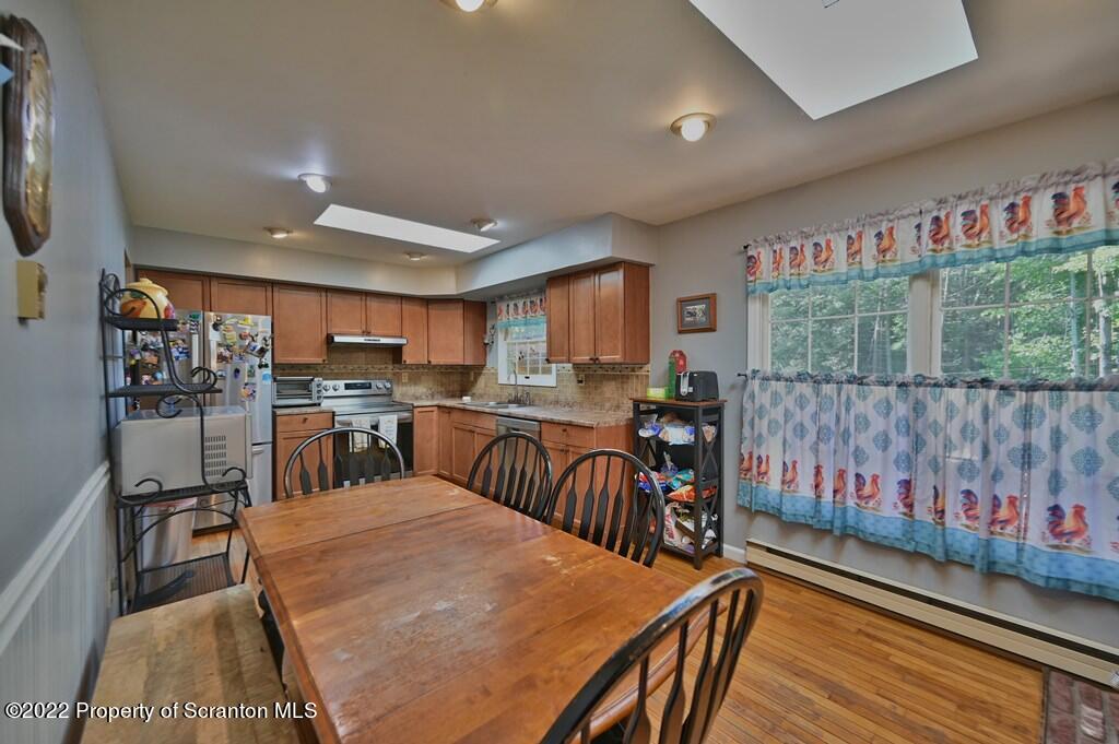 217 Hemlock Road Lake Ariel, PA 18436 - Photo 19 of 54 a living room with lots of furniture and kitchen view