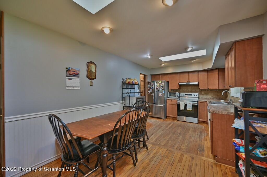 217 Hemlock Road Lake Ariel, PA 18436 - Photo 20 of 54 a view of a dining room with furniture and wooden floor