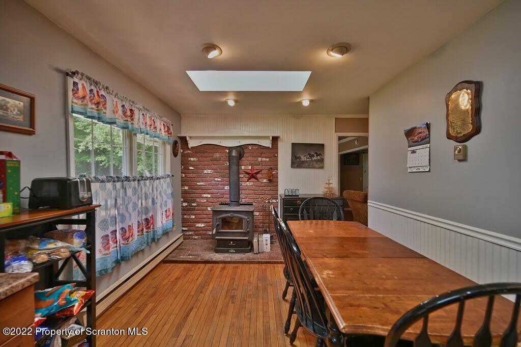 217 Hemlock Road Lake Ariel, PA 18436 - Photo 22 of 54 a dining room with furniture and a floor to ceiling window