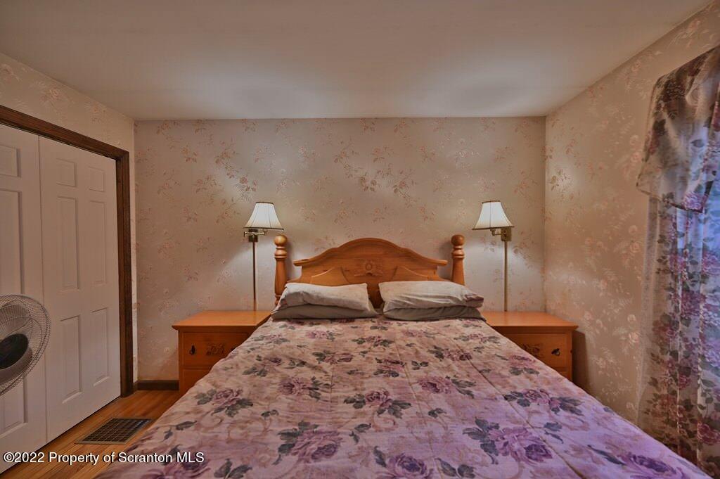 217 Hemlock Road Lake Ariel, PA 18436 - Photo 29 of 54 a bedroom with a bed and a window