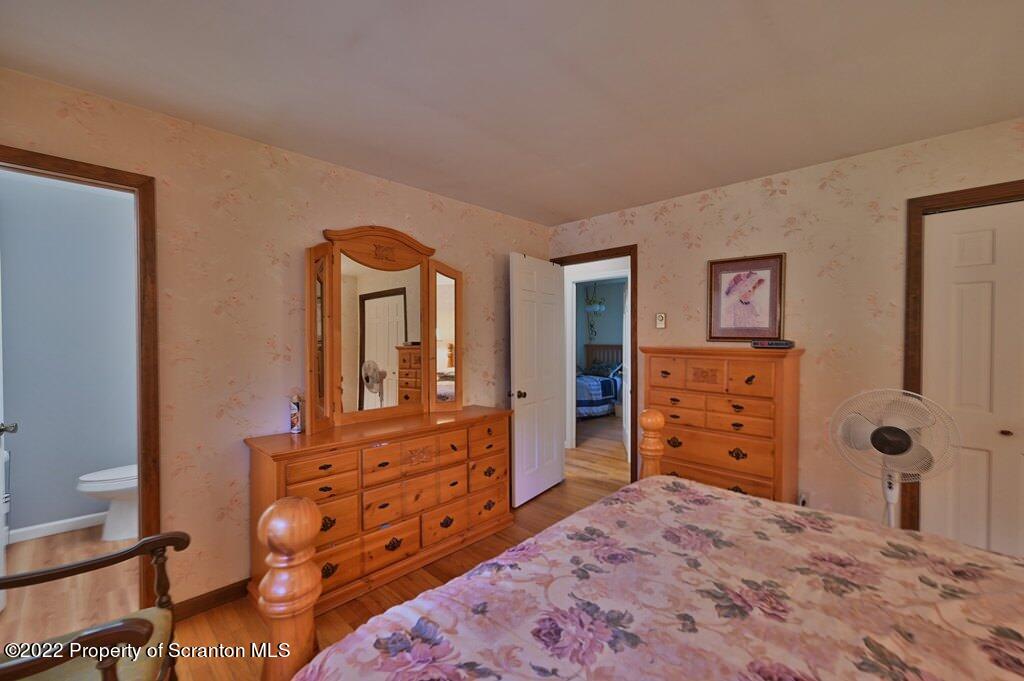 217 Hemlock Road Lake Ariel, PA 18436 - Photo 30 of 54 a bedroom with a dresser and a dresser