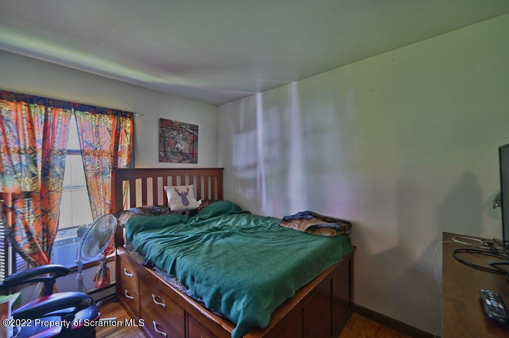 217 Hemlock Road Lake Ariel, PA 18436 - Photo 32 of 54 a bed sitting in a bedroom next to a window