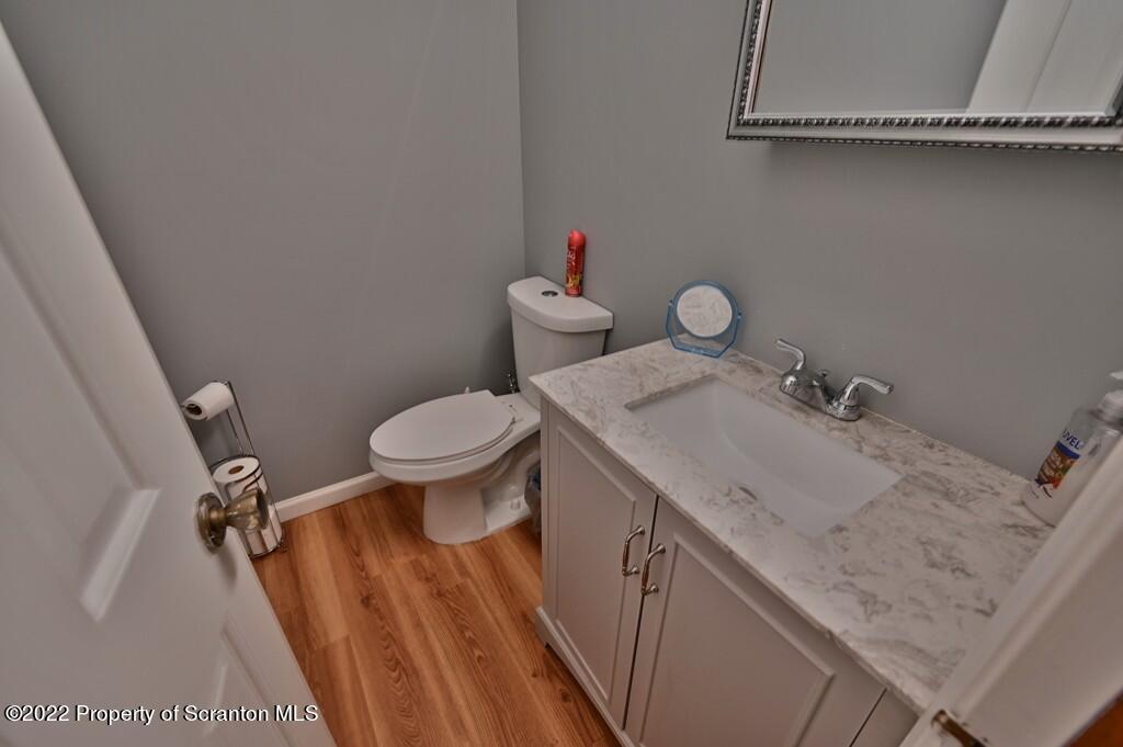 217 Hemlock Road Lake Ariel, PA 18436 - Photo 33 of 54 a bathroom with a granite countertop sink mirror vanity and toilet