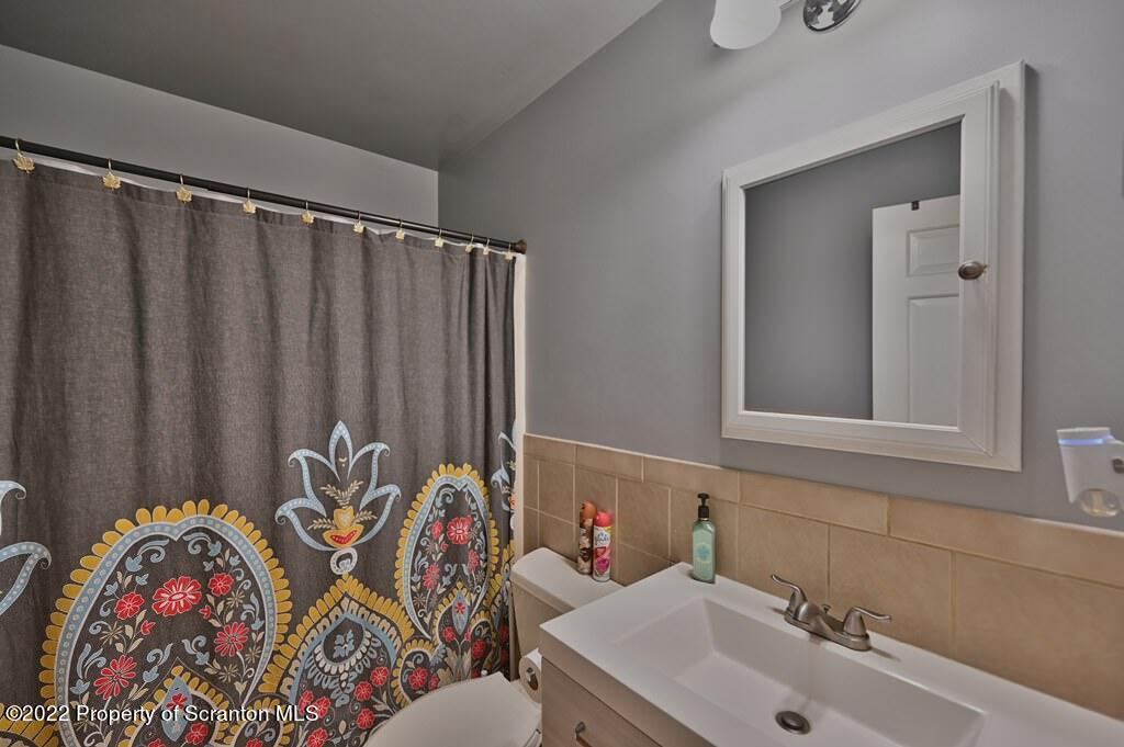 217 Hemlock Road Lake Ariel, PA 18436 - Photo 35 of 54 a bathroom with a sink and a mirror