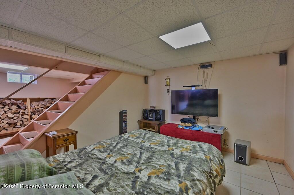 217 Hemlock Road Lake Ariel, PA 18436 - Photo 40 of 54 a bed room with a bed and a television