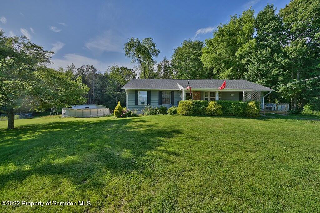 217 Hemlock Road Lake Ariel, PA 18436 - Photo 5 of 54 a front view of a house with a yard