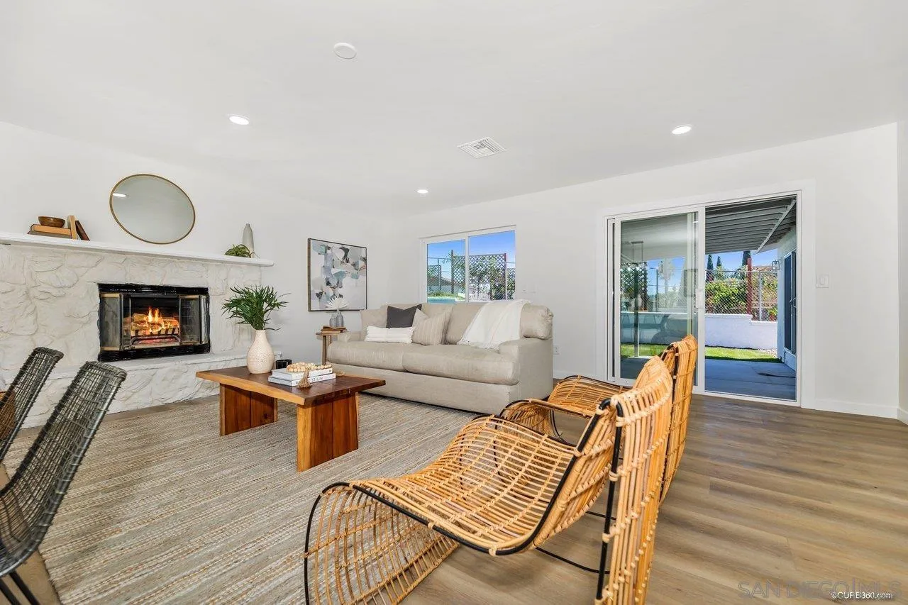 12625 McFeron Road Poway, CA 92064 - Photo 5 of 37 a living room with furniture flat screen tv and fireplace
