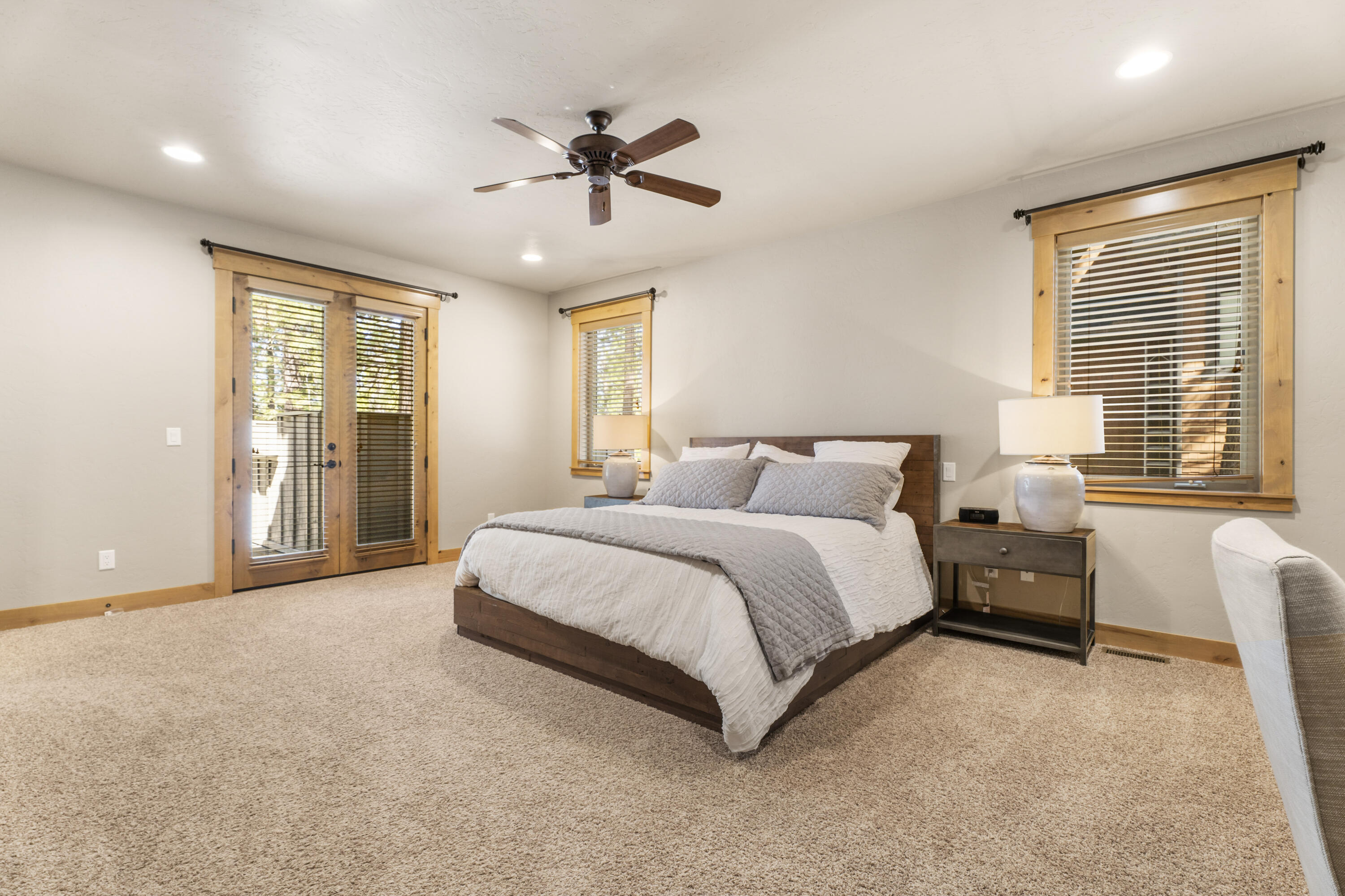 56431 Fireglass Loop, Unit 191 Bend, OR 97707 - Photo 20 of 50 The main level hosts the primary suite, complete with a generous bathroom featuring a soaking tub, a tile shower, and a large walk-in closet.