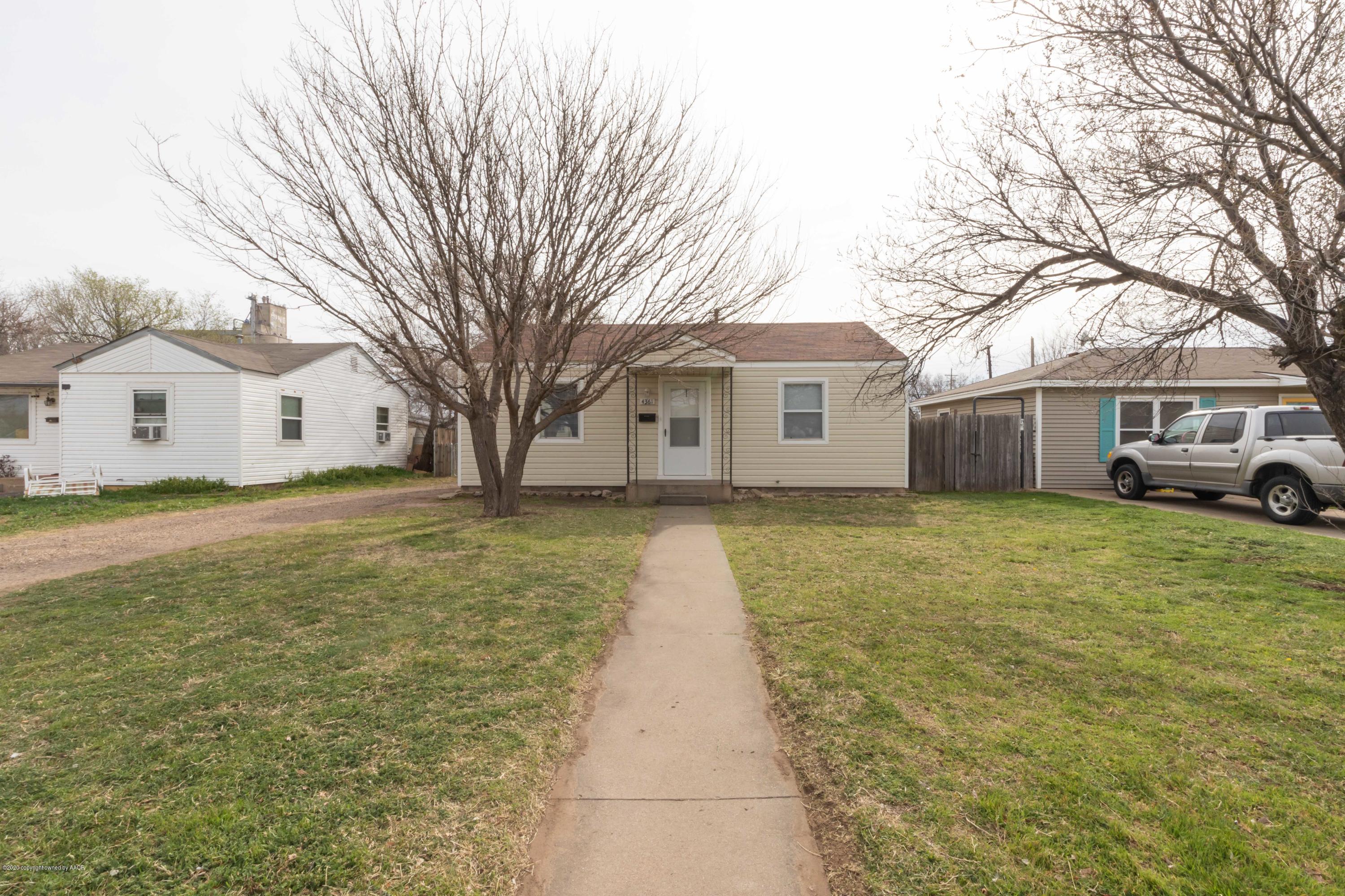 4361 South Tyler Street Amarillo, TX 79110 - Photo 1 of 30 a front view of a house with a yard and garage