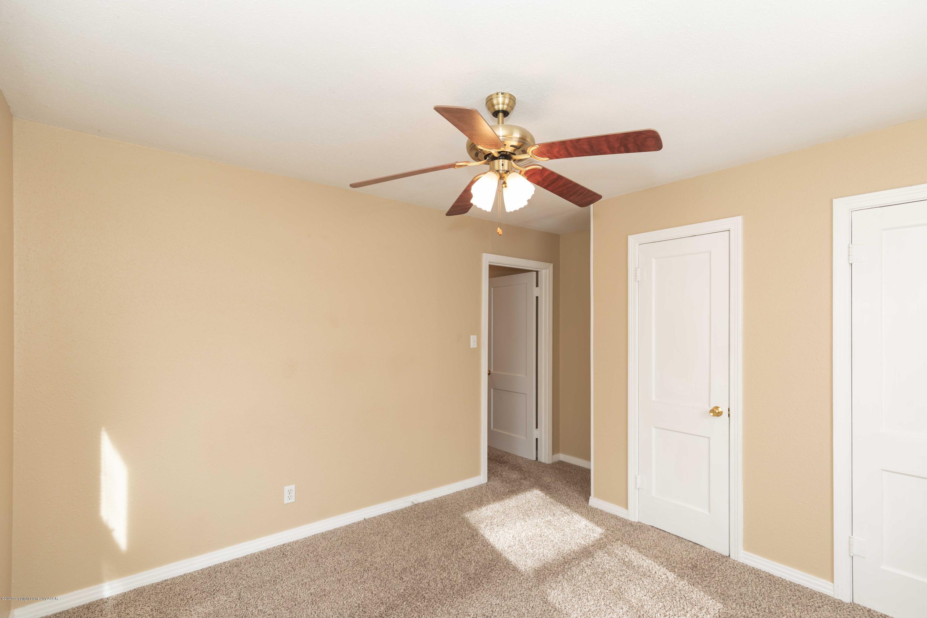 4361 South Tyler Street Amarillo, TX 79110 - Photo 14 of 30 a view of a chandelier fan in a room