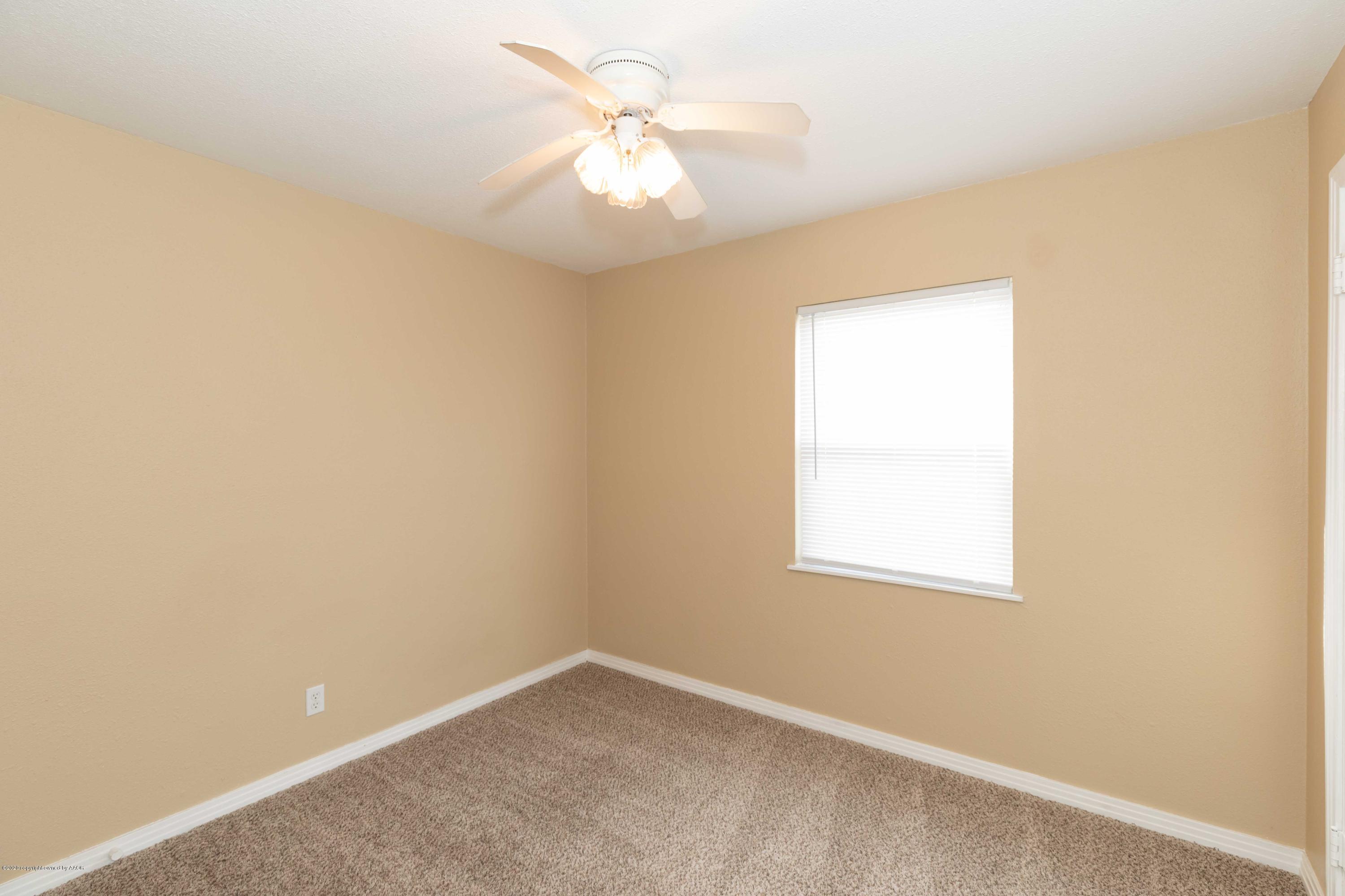 4361 South Tyler Street Amarillo, TX 79110 - Photo 15 of 30 an empty room with a window and a fan