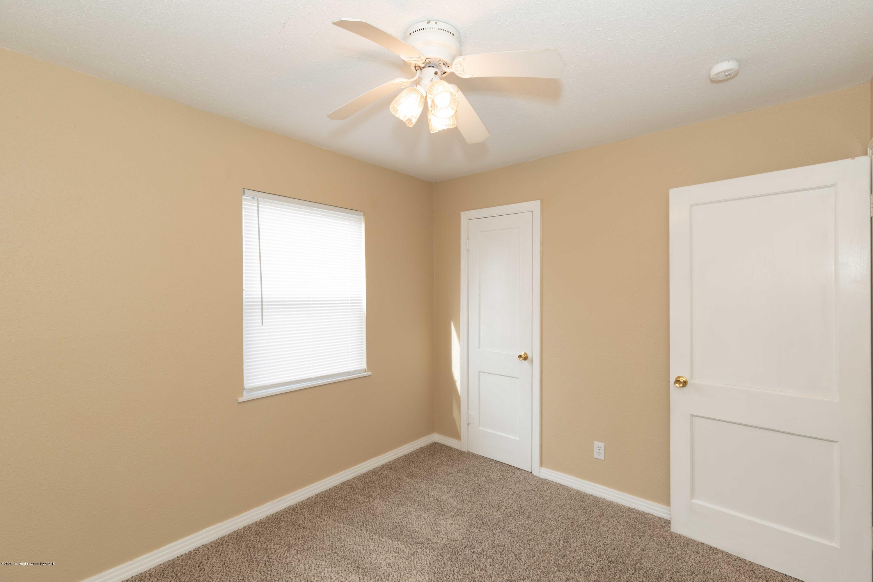 4361 South Tyler Street Amarillo, TX 79110 - Photo 16 of 30 an empty room with windows and fan