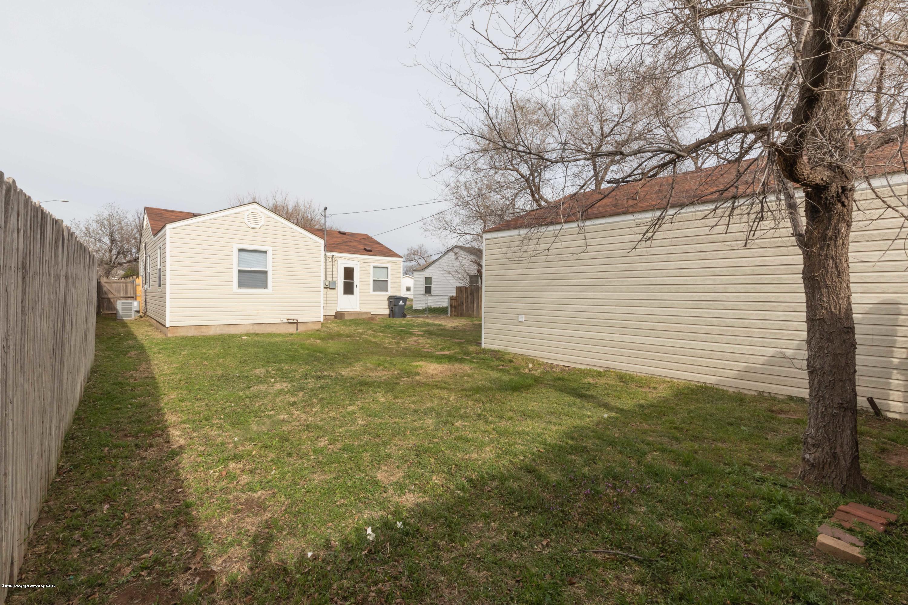 4361 South Tyler Street Amarillo, TX 79110 - Photo 27 of 30 a view of a house with a yard