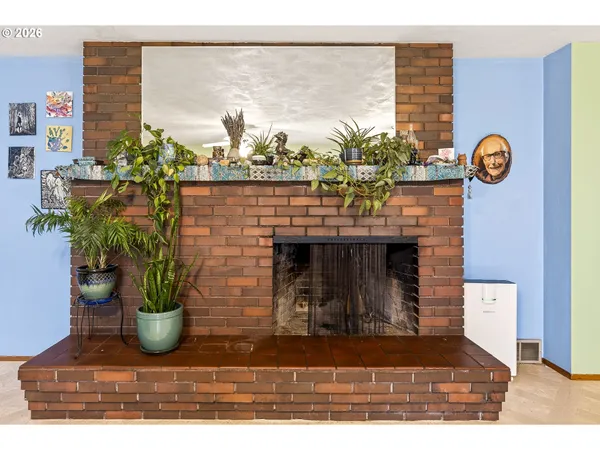a view of living room with furniture and a potted plant