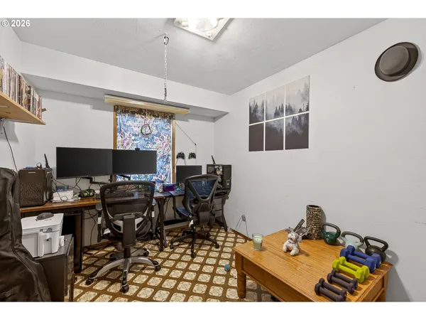 a view of a workspace with furniture