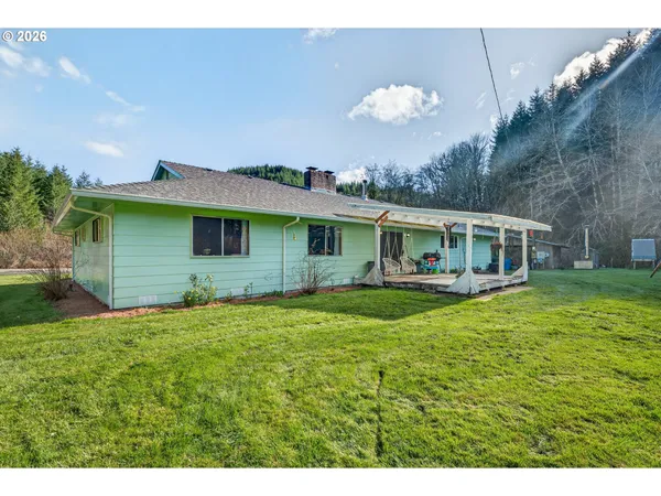 a front view of house with yard and green space