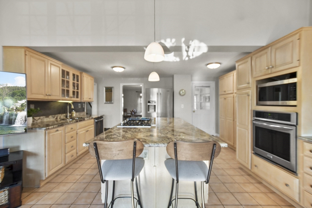 102 Channing Road Watertown, MA 02472 - Photo 8 of 40 a large kitchen with a table and chairs