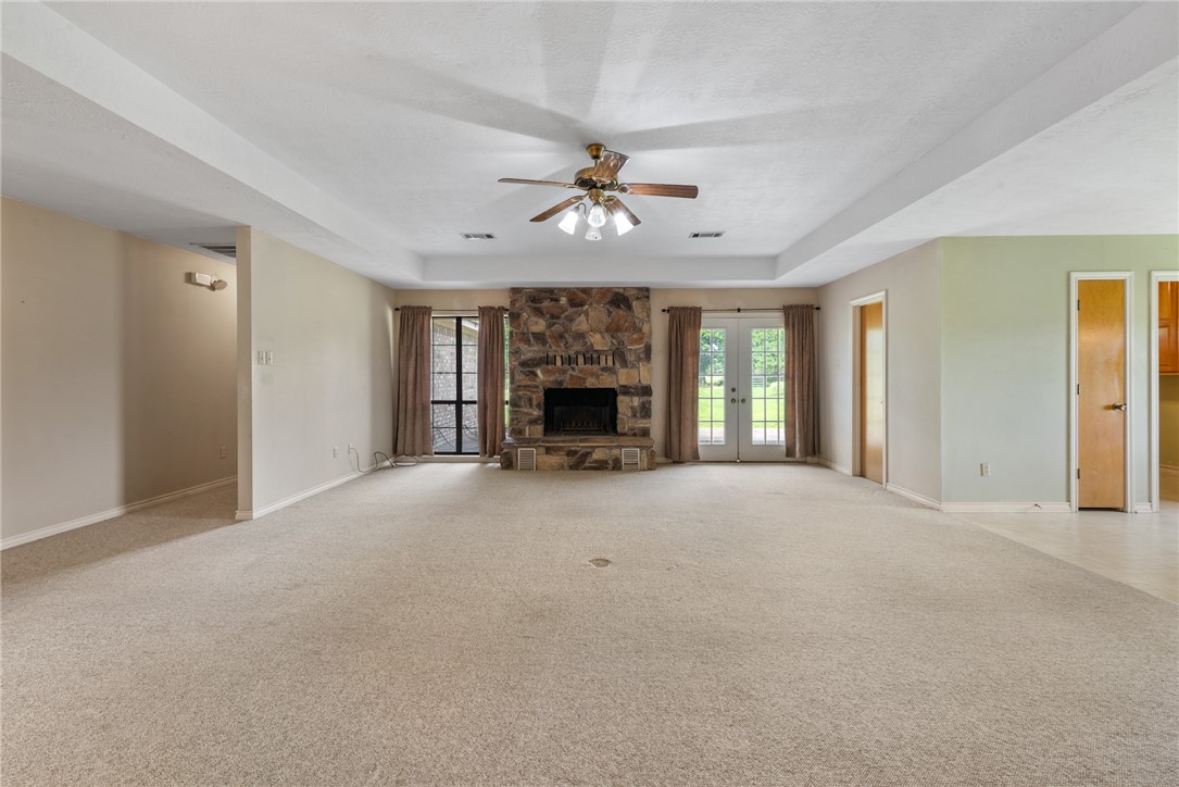 9393 Locke Road Bryan, TX 77808 - Photo 19 of 39 a view of livingroom and fireplace