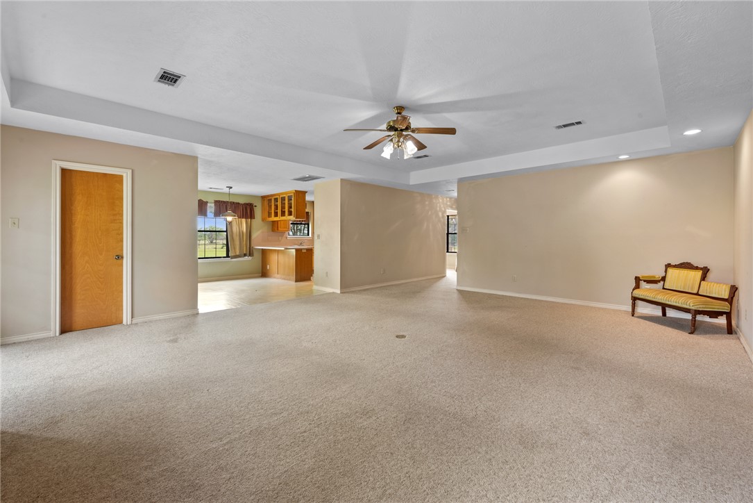 9393 Locke Road Bryan, TX 77808 - Photo 21 of 39 a view of a livingroom with a furniture and chandelier fan