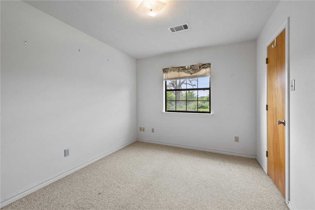 9393 Locke Road Bryan, TX 77808 - Photo 28 of 39 an empty room with windows