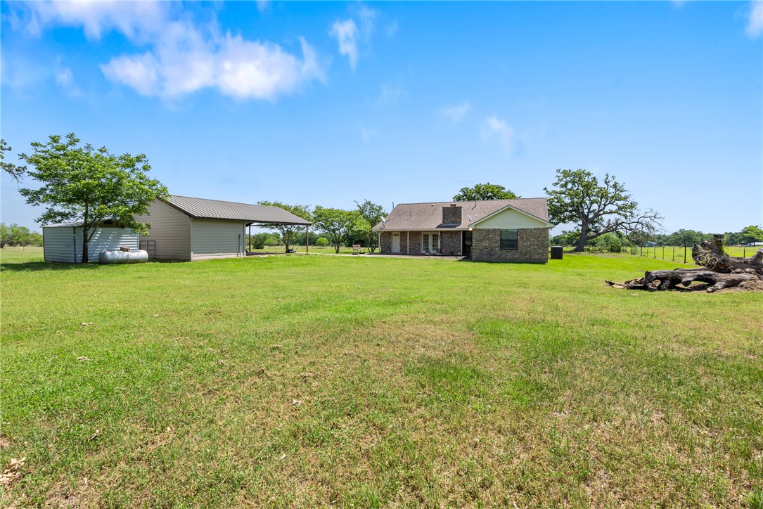 9393 Locke Road Bryan, TX 77808 - Photo 36 of 39 a view of a garden with a house in the background