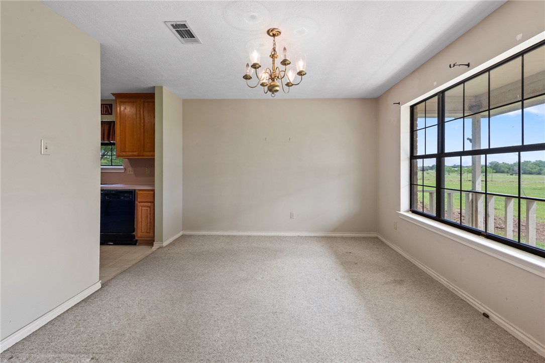 9393 Locke Road Bryan, TX 77808 - Photo 10 of 39 a view of an empty room with a window