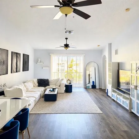 a living room with furniture fireplace and a flat screen tv