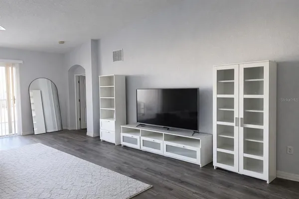 a view of a livingroom with furniture and wooden floor