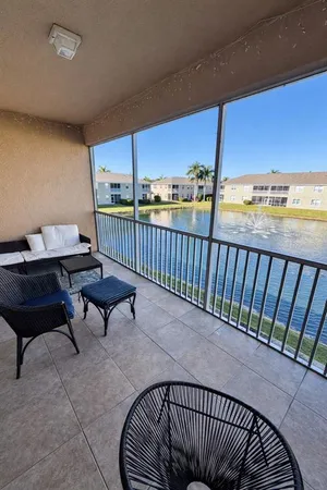 a roof deck with a table and chairs