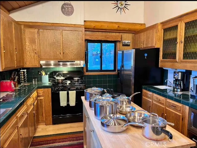 a view of a living room with a floor to ceiling window and an outdoor view