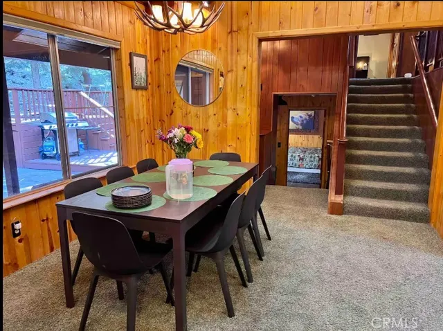 a bathroom with a granite countertop toilet sink and mirror