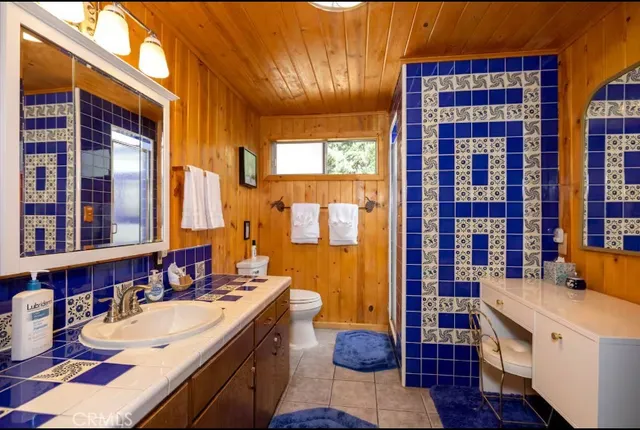 a view of a table and chairs under an umbrella in the patio